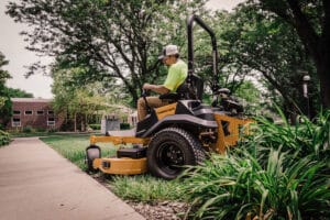 A fabricated Hustler's deckshrugs off the knocks, keeping the blade plane straight and the spindle housings stable. Image: Hustler Mowers